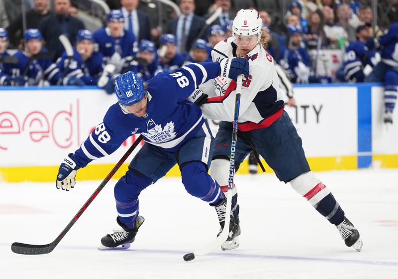 Dec 6, 2024; Toronto, Ontario, CAN; Toronto Maple Leafs right wing William Nylander (88) battles for the puck with Washington Capitals defenseman Jakob Chychrun (6) during the first period at Scotiabank Arena. Mandatory Credit: Nick Turchiaro-Imagn Images