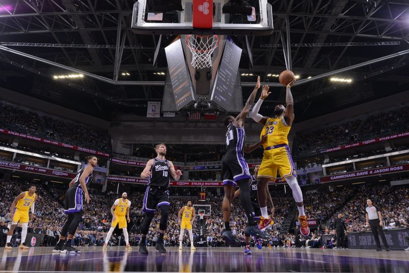 SACRAMENTO, CA - MARCH 13:  LeBron James #23 of the Los Angeles Lakers drives to the basket during the game against the Sacramento Kings on March 13, 2024 at Golden 1 Center in Sacramento, California. NOTE TO USER: User expressly acknowledges and agrees that, by downloading and or using this Photograph, user is consenting to the terms and conditions of the Getty Images License Agreement. Mandatory Copyright Notice: Copyright 2024 NBAE (Photo by Rocky Widner/NBAE via Getty Images)