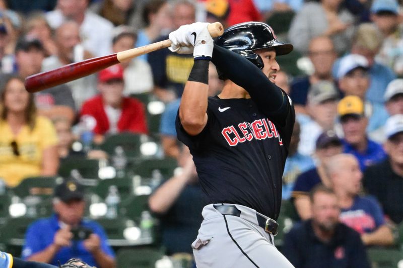 Aug 18, 2024; Milwaukee, Wisconsin, USA; Cleveland Guardians designated hitter Steven Kwan (38) hits a single to break up a no-hitter in the sixth inning against the Milwaukee Brewers at American Family Field. Mandatory Credit: Benny Sieu-USA TODAY Sports