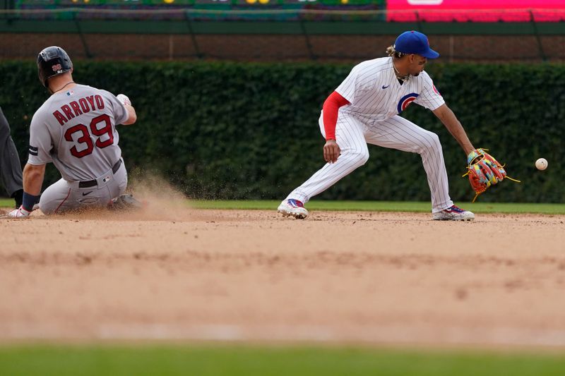 Jul 15, 2023; Chicago, Illinois, USA; Boston Red Sox second baseman Christian Arroyo (39) is safe at second base with a double as Chicago Cubs second baseman Christopher Morel (5) takes the throw during the ninth inning at Wrigley Field. Mandatory Credit: David Banks-USA TODAY Sports