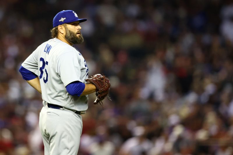 Oct 11, 2023; Phoenix, Arizona, USA; Los Angeles Dodgers starting pitcher Lance Lynn (35) prepares to throw a pitch against the Arizona Diamondbacks in the first inning for game three of the NLDS for the 2023 MLB playoffs at Chase Field. Mandatory Credit: Mark J. Rebilas-USA TODAY Sports