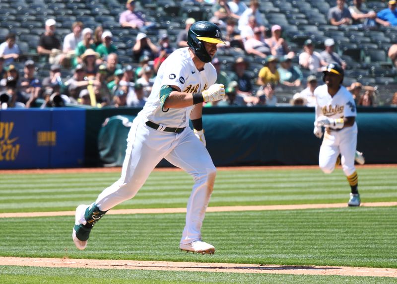 Jun 15, 2023; Oakland, California, USA; Oakland Athletics designated hitter Seth Brown (15) hits into a double play with bases loaded as second baseman Tony Kemp (5) runs before being tagged out at home during the seventh inning against the Tampa Bay Rays at Oakland-Alameda County Coliseum. Mandatory Credit: Kelley L Cox-USA TODAY Sports