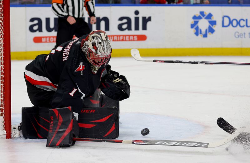 Jan 18, 2024; Buffalo, New York, USA;  Buffalo Sabres goaltender Ukko-Pekka Luukkonen (1) makes a save during the third period against the Chicago Blackhawks at KeyBank Center. Mandatory Credit: Timothy T. Ludwig-USA TODAY Sports