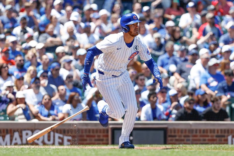 Jun 2, 2024; Chicago, Illinois, USA; Chicago Cubs outfielder Cody Bellinger (24) singles against the Cincinnati Reds during the first inning at Wrigley Field. Mandatory Credit: Kamil Krzaczynski-USA TODAY Sports