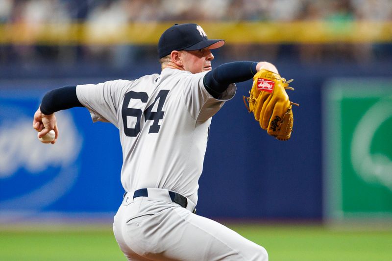 May 12, 2024; St. Petersburg, Florida, USA;  New York Yankees pitcher Caleb Ferguson (64) throws a pitch against the Tampa Bay Rays in the seventh inning at Tropicana Field. Mandatory Credit: Nathan Ray Seebeck-USA TODAY Sports