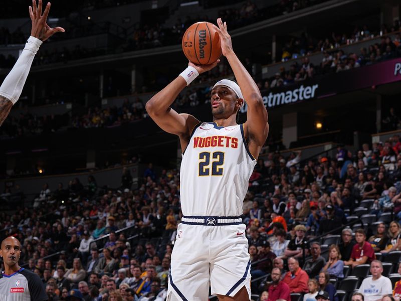 DENVER, CO - OCTOBER 13: Zeke Nnaji #22 of the Denver Nuggets shoots a three point basket during the game against the Phoenix Suns on October 13, 2024 at Ball Arena in Denver, Colorado. NOTE TO USER: User expressly acknowledges and agrees that, by downloading and/or using this Photograph, user is consenting to the terms and conditions of the Getty Images License Agreement. Mandatory Copyright Notice: Copyright 2024 NBAE (Photo by Garrett Ellwood/NBAE via Getty Images)