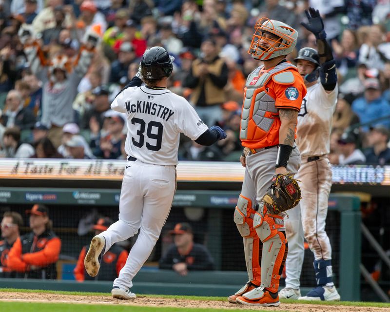 Apr 26, 2025; Detroit, Michigan, USA; Detroit Tigers outfielder Zach McKinstry (39) scores a run on a single by third base Jace Jung (17) during game one of a double header against the Baltimore Orioles at Comerica Park. Mandatory Credit: David Reginek-Imagn Images