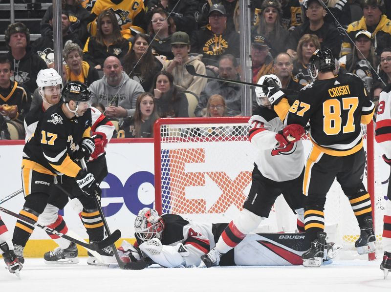 Nov 16, 2023; Pittsburgh, Pennsylvania, USA; Pittsburgh Penguins right wing Bryan Rust (17) is stopped by New Jersey Devils goalie Vitek Vanecek (41) during the first period at PPG Paints Arena. Mandatory Credit: Philip G. Pavely-USA TODAY Sports