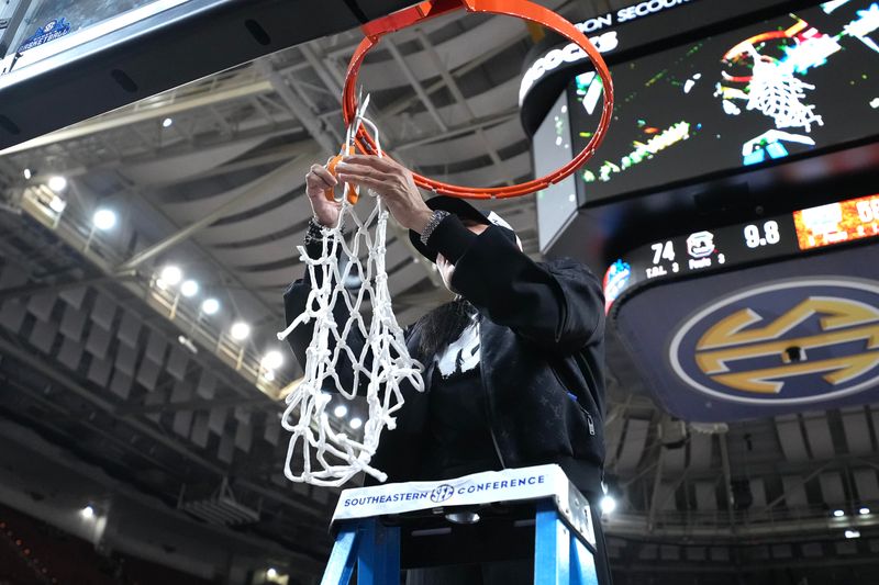 Mar 5, 2023; Greenville, SC, USA; South Carolina Gamecocks head coach Dawn Staley cuts down the net after winning the SEC Championship at Bon Secours Wellness Arena. Mandatory Credit: David Yeazell-USA TODAY Sports