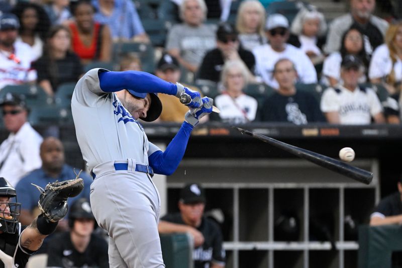 Jun 24, 2024; Chicago, Illinois, USA;  Los Angeles Dodgers first base Freddie Freeman (5) breaks his bat during the first inning against the Chicago White Sox at Guaranteed Rate Field. Mandatory Credit: Matt Marton-USA TODAY Sports