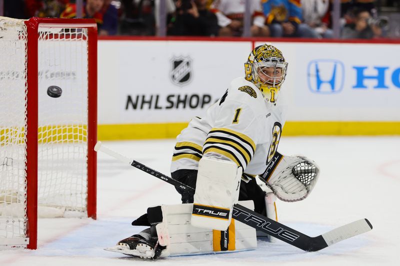 May 6, 2024; Sunrise, Florida, USA; Boston Bruins goaltender Jeremy Swayman (1) watches as the puck goes past the goal against the Florida Panthers during the second period in game one of the second round of the 2024 Stanley Cup Playoffs at Amerant Bank Arena. Mandatory Credit: Sam Navarro-USA TODAY Sports