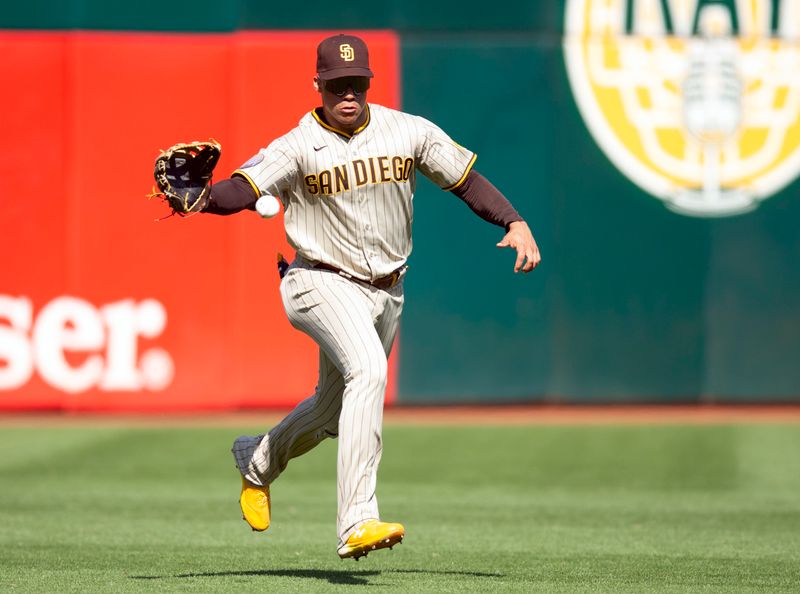 Sep 16, 2023; Oakland, California, USA; San Diego Padres left fielder Juan Soto (22) plays a single by Oakland Athletics center fielder Lawrence Butler on a hop during the sixth inning at Oakland-Alameda County Coliseum. Mandatory Credit: D. Ross Cameron-USA TODAY Sports