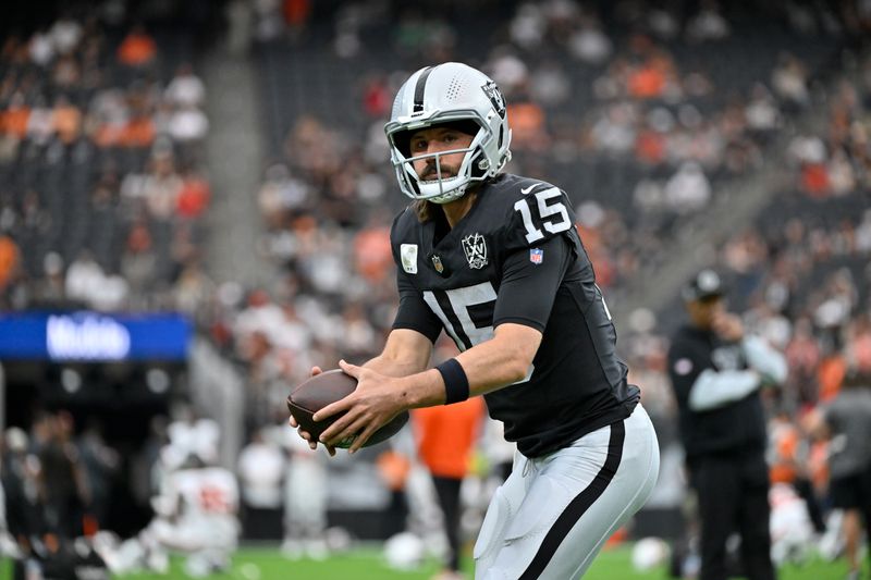 Las Vegas Raiders quarterback Gardner Minshew warms up before an NFL football game against the Cleveland Browns Sunday, Sept. 29, 2024, in Las Vegas. (AP Photo/David Becker)