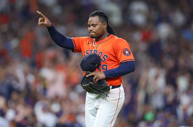 Jul 26, 2024; Houston, Texas, USA; Houston Astros starting pitcher Framber Valdez (59) walks off the field after a pitching change during the seventh inning against the Los Angeles Dodgers at Minute Maid Park. Mandatory Credit: Troy Taormina-USA TODAY Sports