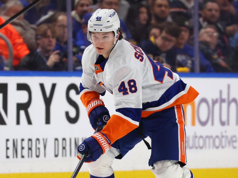 Dec 20, 2025; Buffalo, New York, USA;  New York Islanders defenseman Matthew Schaefer (48) skates up ice with the puck during the third period against the Buffalo Sabres at KeyBank Center. Mandatory Credit: Timothy T. Ludwig-Imagn Images