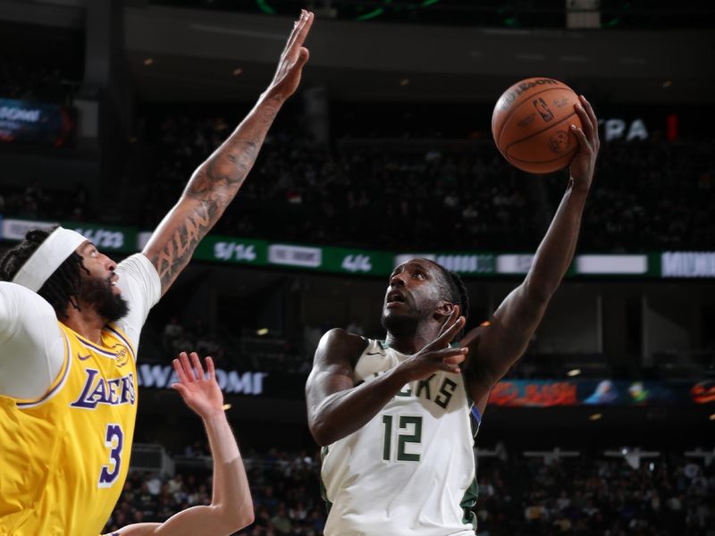 MILWAUKEE, WI - OCTOBER 10: Taurean Prince #12 of the Milwaukee Bucks shoots the ball during the game against the Los Angeles Lakers during a preseason game on October 10, 2024 at Fiserv Forum Center in Milwaukee, Wisconsin. NOTE TO USER: User expressly acknowledges and agrees that, by downloading and or using this Photograph, user is consenting to the terms and conditions of the Getty Images License Agreement. Mandatory Copyright Notice: Copyright 2024 NBAE (Photo by Gary Dineen/NBAE via Getty Images).