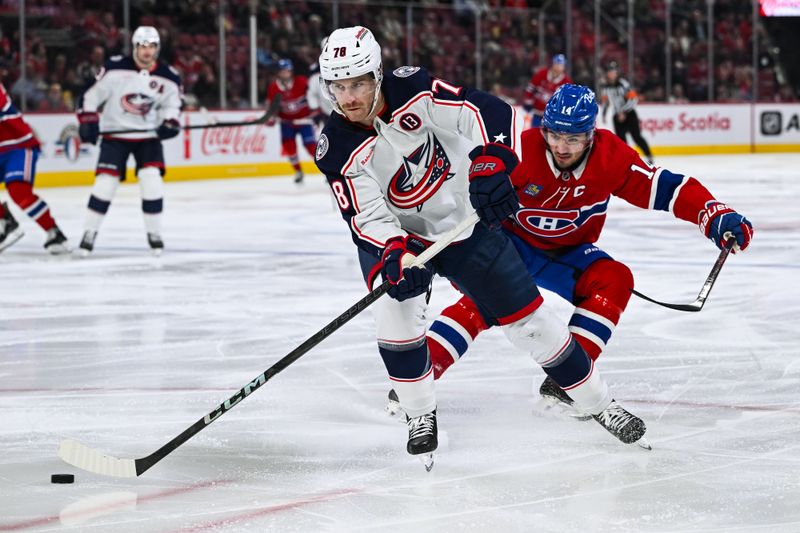 Nov 16, 2024; Montreal, Quebec, CAN; Columbus Blue Jackets defenseman Damon Severson (78) defends the puck against Montreal Canadiens center Nick Suzuki (14) during the second period at Bell Centre. Mandatory Credit: David Kirouac-Imagn Images