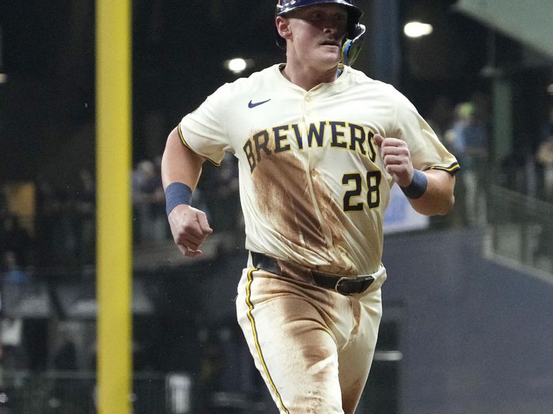 Sep 18, 2025; Milwaukee, Wisconsin, USA; Milwaukee Brewers first base Andrew Vaughn (28) runs to third base against the Los Angeles Angels in the fourth inning at American Family Field. Mandatory Credit: Michael McLoone-Imagn Images