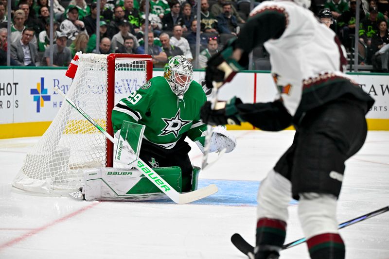 Nov 14, 2023; Dallas, Texas, USA; Dallas Stars goaltender Jake Oettinger (29) stops a shot by Arizona Coyotes center Nick Schmaltz (8) during the first period at the American Airlines Center. Mandatory Credit: Jerome Miron-USA TODAY Sports