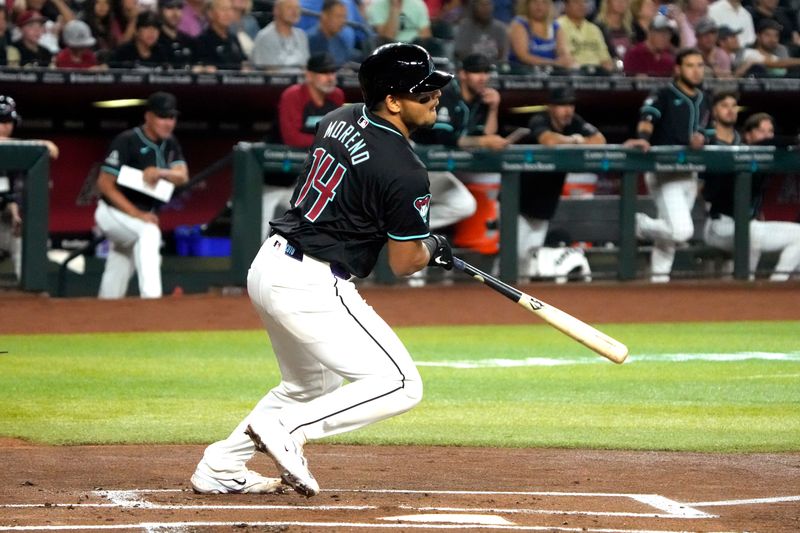 Jun 3, 2024; Phoenix, Arizona, USA; Arizona Diamondbacks catcher Gabriel Moreno (14) hits a single against the San Francisco Giants in the first inning at Chase Field. Mandatory Credit: Rick Scuteri-USA TODAY Sports