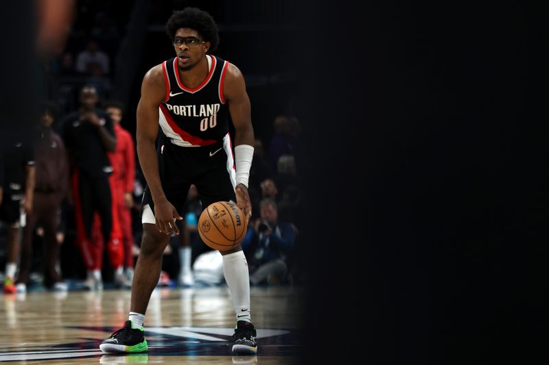 CHARLOTTE, NORTH CAROLINA - APRIL 03: Scoot Henderson #00 of the Portland Trail Blazers controls the ball during the second half against the Charlotte Hornets at Spectrum Center on April 03, 2024 in Charlotte, North Carolina. NOTE TO USER: User expressly acknowledges and agrees that, by downloading and or using this photograph, User is consenting to the terms and conditions of the Getty Images License Agreement. (Photo by David Jensen/Getty Images)