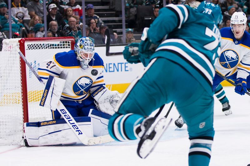 Nov 23, 2024; San Jose, California, USA;  Buffalo Sabres goaltender James Reimer (47) deflects a shot by San Jose Sharks center Tyler Toffoli (73) during the second period at SAP Center in San Jose. Mandatory Credit: John Hefti-Imagn Images