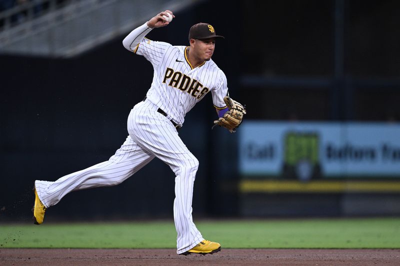 Jul 8, 2023; San Diego, California, USA; San Diego Padres third baseman Manny Machado (13) throws to second base for a force out against the New York Mets during the third inning at Petco Park. Mandatory Credit: Orlando Ramirez-USA TODAY Sports