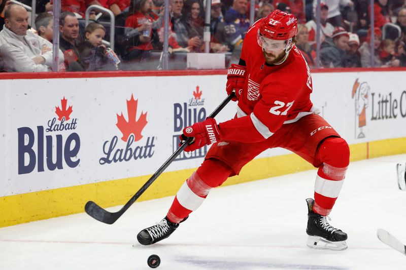 Feb 24, 2024; Detroit, Michigan, USA;  Detroit Red Wings center Michael Rasmussen (27) skates with the puck in the second period against the St. Louis Blues at Little Caesars Arena. Mandatory Credit: Rick Osentoski-USA TODAY Sports