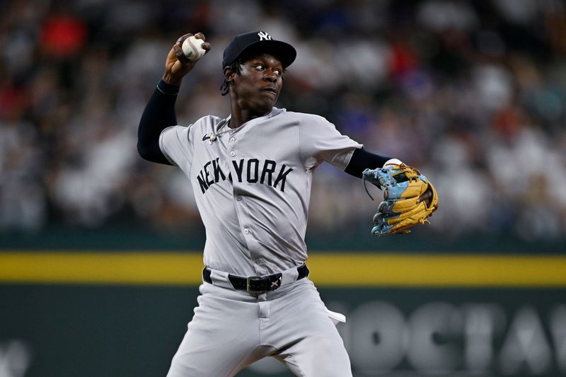 Sep 2, 2024; Arlington, Texas, USA; New York Yankees third baseman Jazz Chisholm Jr. (13) throws to first base during the second inning at Globe Life Field. Mandatory Credit: Jerome Miron-USA TODAY Sports