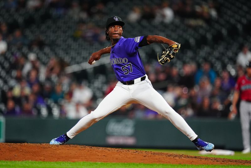 Sep 17, 2024; Denver, Colorado, USA; Colorado Rockies relief pitcher Angel Chivilli (57) delivers a pitch in the ninth inning against the Arizona Diamondbacks at Coors Field. Mandatory Credit: Ron Chenoy-Imagn Images