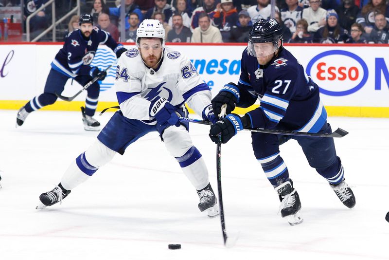 Jan 2, 2024; Winnipeg, Manitoba, CAN; Winnipeg Jets left wing Nikolaj Ehlers (27) is stick checked by Tampa Bay Lightning center Tyler Motte (64) in the first period at Canada Life Centre. Mandatory Credit: James Carey Lauder-USA TODAY Sports