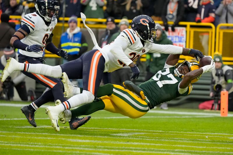Chicago Bears cornerback Tyrique Stevenson breaks up a pass intended for Green Bay Packers wide receiver Romeo Doubs (87) during the first half of an NFL football game Sunday, Jan. 7, 2024, in Green Bay, Wis. (AP Photo/Morry Gash)