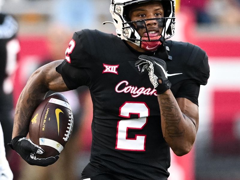 Oct 12, 2023; Houston, Texas, USA; Houston Cougars wide receiver Matthew Golden (2) runs the ball back for a touchdown on a kick off during the first quarter against the West Virginia Mountaineers  at TDECU Stadium. Mandatory Credit: Maria Lysaker-USA TODAY Sports