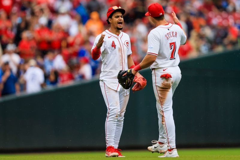 May 26, 2024; Cincinnati, Ohio, USA; Cincinnati Reds third baseman Santiago Espinal (4) high fives first baseman Spencer Steer (7) after the victory over the Los Angeles Dodgers at Great American Ball Park. Mandatory Credit: Katie Stratman-USA TODAY Sports