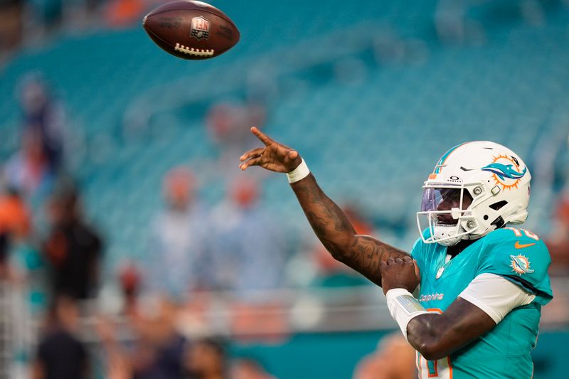 Miami Dolphins quarterback Tyler Huntley (18) warms up before an NFL football game against the Tennessee Titans, Monday, Sept. 30, 2024, in Miami Gardens, Fla. (AP Photo/Rebecca Blackwell)