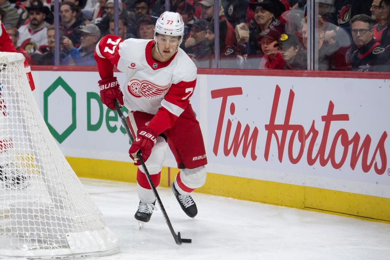 Dec 5, 2024; Ottawa, Ontario, CAN;  Detroit Red Wings defenseman Simon Edvinsson (77) skates with the puck in the first period against the Ottawa Senators at the Canadian Tire Centre. Mandatory Credit: Marc DesRosiers-Imagn Images