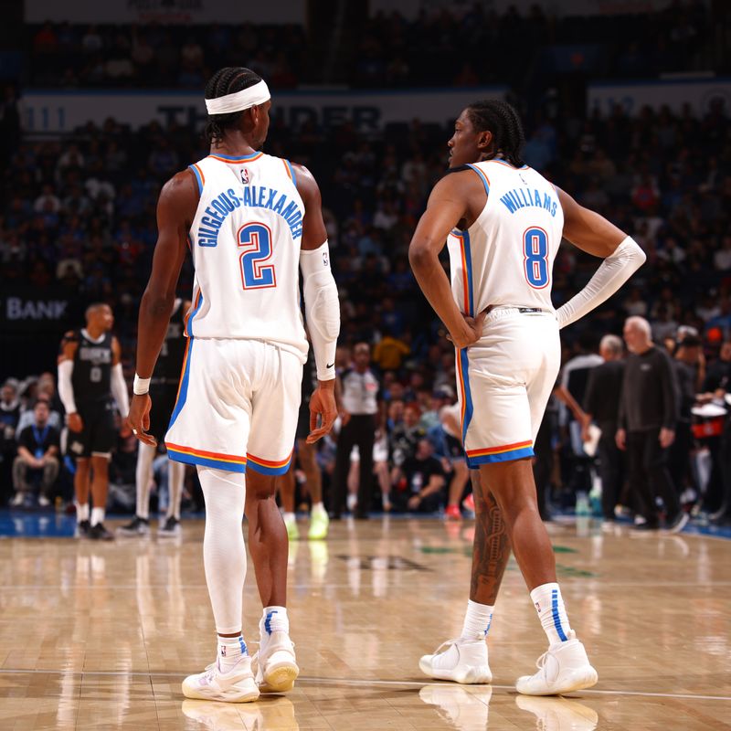 OKLAHOMA CITY, OK - OCTOBER 30: Shai Gilgeous-Alexander #2 and Jalen Williams #8 of the Oklahoma City Thunder look on during the game against the San Antonio Spurs on October 30, 2024 at Paycom Arena in Oklahoma City, Oklahoma. NOTE TO USER: User expressly acknowledges and agrees that, by downloading and or using this photograph, User is consenting to the terms and conditions of the Getty Images License Agreement. Mandatory Copyright Notice: Copyright 2024 NBAE (Photo by Zach Beeker/NBAE via Getty Images)