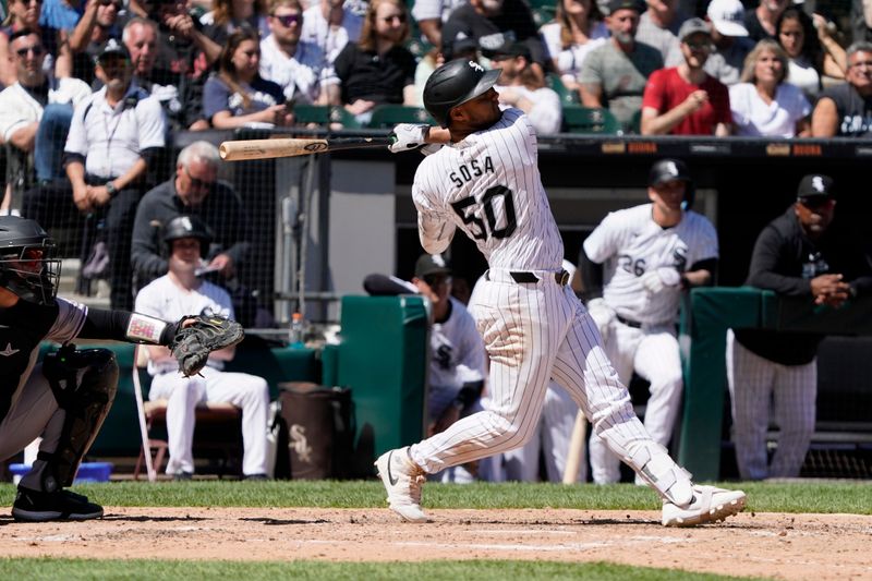 Jun 30, 2024; Chicago, Illinois, USA; Chicago White Sox third base Lenyn Sosa (50) hits a single against the Colorado Rockies during the ninth inning at Guaranteed Rate Field. Mandatory Credit: David Banks-USA TODAY Sports