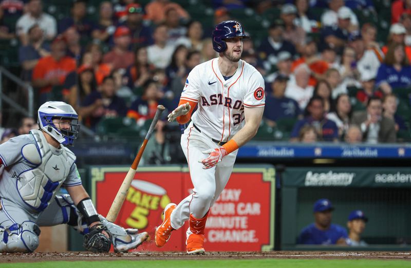 Apr 3, 2024; Houston, Texas, USA; Houston Astros right fielder Kyle Tucker (30) hits a single during the first inning against the Toronto Blue Jays at Minute Maid Park. Mandatory Credit: Troy Taormina-USA TODAY Sports