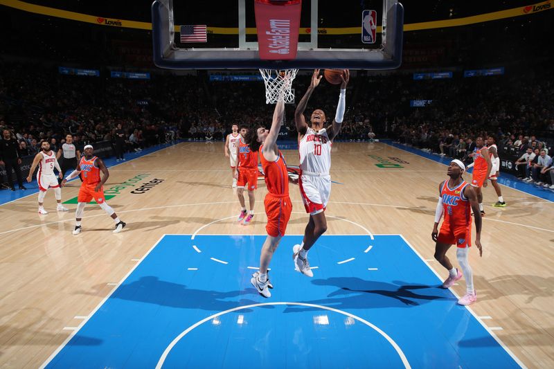 OKLAHOMA CITY, OK - FEBRUARY 27: Jabari Smith Jr. #10 of the Houston Rockets drives to the basket during the game against the Oklahoma City Thunder on February, 2024 at Paycom Arena in Oklahoma City, Oklahoma. NOTE TO USER: User expressly acknowledges and agrees that, by downloading and or using this photograph, User is consenting to the terms and conditions of the Getty Images License Agreement. Mandatory Copyright Notice: Copyright 2024 NBAE (Photo by Zach Beeker/NBAE via Getty Images)