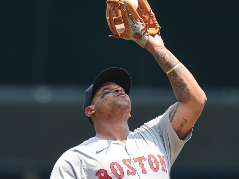 Jul 6, 2024; Bronx, New York, USA; Boston Red Sox third baseman Rafael Devers (11) makes a catch for an out during the first inning against the New York Yankees at Yankee Stadium. Mandatory Credit: Vincent Carchietta-USA TODAY Sports