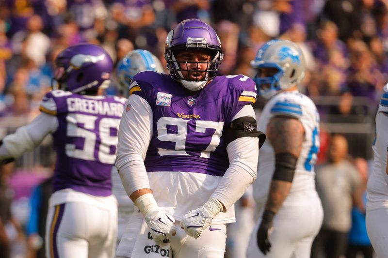 Minnesota Vikings defensive tackle Harrison Phillips (97) reacts to a third down stop against the Detroit Lions during the first half of an NFL football game Sunday, Oct. 20, 2024, in Minneapolis. (AP Photo/Bruce Kluckhohn)