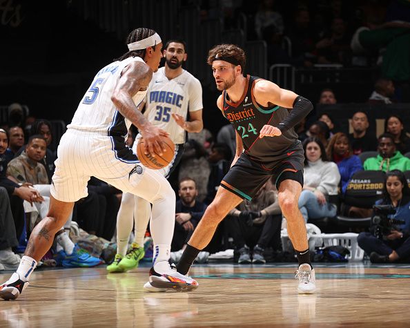 WASHINGTON, DC -? DECEMBER 26:  Corey Kispert #24 of the Washington Wizards plays defense during the game  against Paolo Banchero #5 of the Orlando Magic on December 26, 2023 at Capital One Arena in Washington, DC. NOTE TO USER: User expressly acknowledges and agrees that, by downloading and or using this Photograph, user is consenting to the terms and conditions of the Getty Images License Agreement. Mandatory Copyright Notice: Copyright 2023 NBAE (Photo by Stephen Gosling/NBAE via Getty Images)