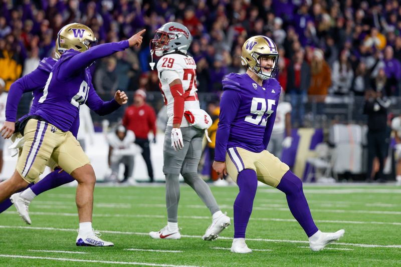 Nov 25, 2023; Seattle, Washington, USA; Washington Huskies place kicker Grady Gross (95) celebrates after kicking a game-winning field goal against the Washington State Cougars during the fourth quarter at Alaska Airlines Field at Husky Stadium. Washington defeated Washington State, 24-21. Mandatory Credit: Joe Nicholson-USA TODAY Sports