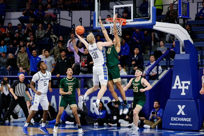 Mar 9, 2024; Colorado Springs, Colorado, USA; Air Force Falcons forward Rytis Petraitis (31) drives to the net against Colorado State Rams guard Nique Clifford (10) in the first half at Clune Arena. Mandatory Credit: Isaiah J. Downing-USA TODAY Sports