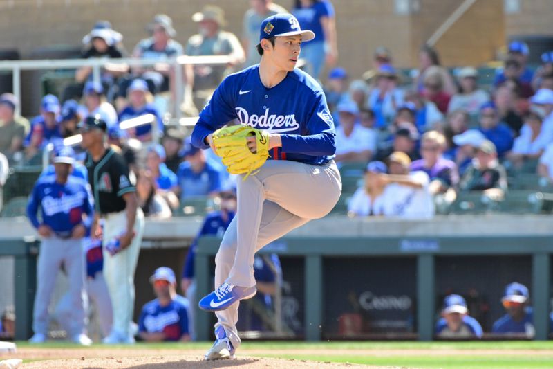 Feb 25, 2026; Salt River Pima-Maricopa, Arizona, USA; Los Angeles Dodgers pitcher Roki Sasaki (11) throws in the first inning against the Arizona Diamondbacks at Salt River Fields at Talking Stick. Mandatory Credit: Matt Kartozian-Imagn Images