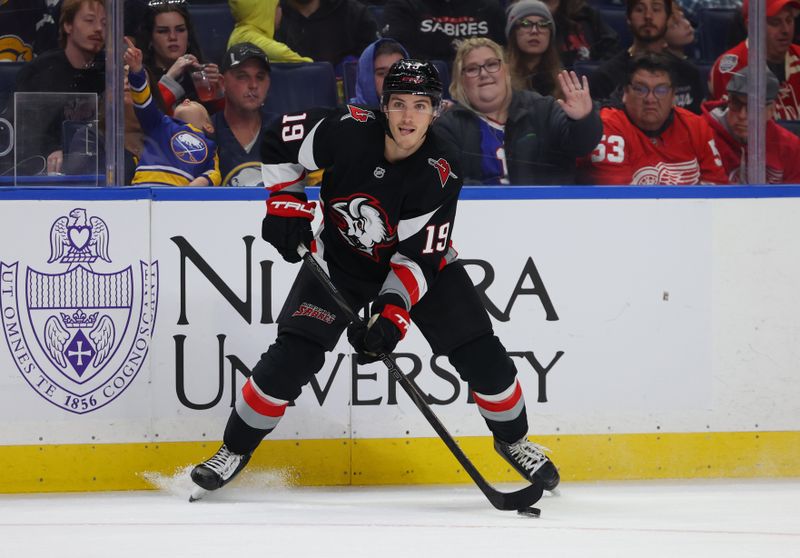 Oct 26, 2024; Buffalo, New York, USA;  Buffalo Sabres center Peyton Krebs (19) looks to make a pass during the second period against the Detroit Red Wings at KeyBank Center. Mandatory Credit: Timothy T. Ludwig-Imagn Images