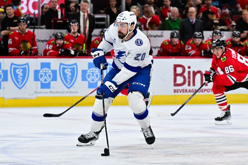 Jan 24, 2025; Chicago, Illinois, USA; Tampa Bay Lightning center Nick Paul (20) skates with the puck against the Chicago Blackhawks during the second period at the United Center. Mandatory Credit: Daniel Bartel-Imagn Images