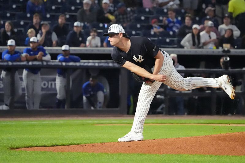 Feb 28, 2025; Tampa, Florida, USA; New York Yankees pitcher Gerrit Cole (45) throws a pitch against the Toronto Blue Jays during the first inning at George M. Steinbrenner Field. Mandatory Credit: Dave Nelson-Imagn Images