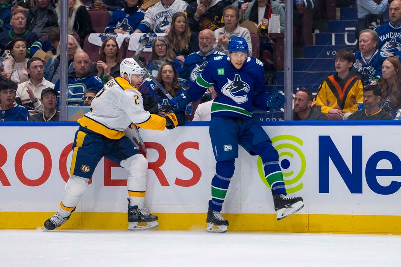 Apr 21, 2024; Vancouver, British Columbia, CAN; Vancouver Canucks forward Dakota Joshua (81) checks Nashville Predators defenseman Luke Schenn (2) in the first period in game one of the first round of the 2024 Stanley Cup Playoffs at Rogers Arena. Mandatory Credit: Bob Frid-USA TODAY Sports